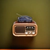 Brown vintage portable radio with solar panel and antenna, an old-fashioned rechargeable outdoor radio Specification image